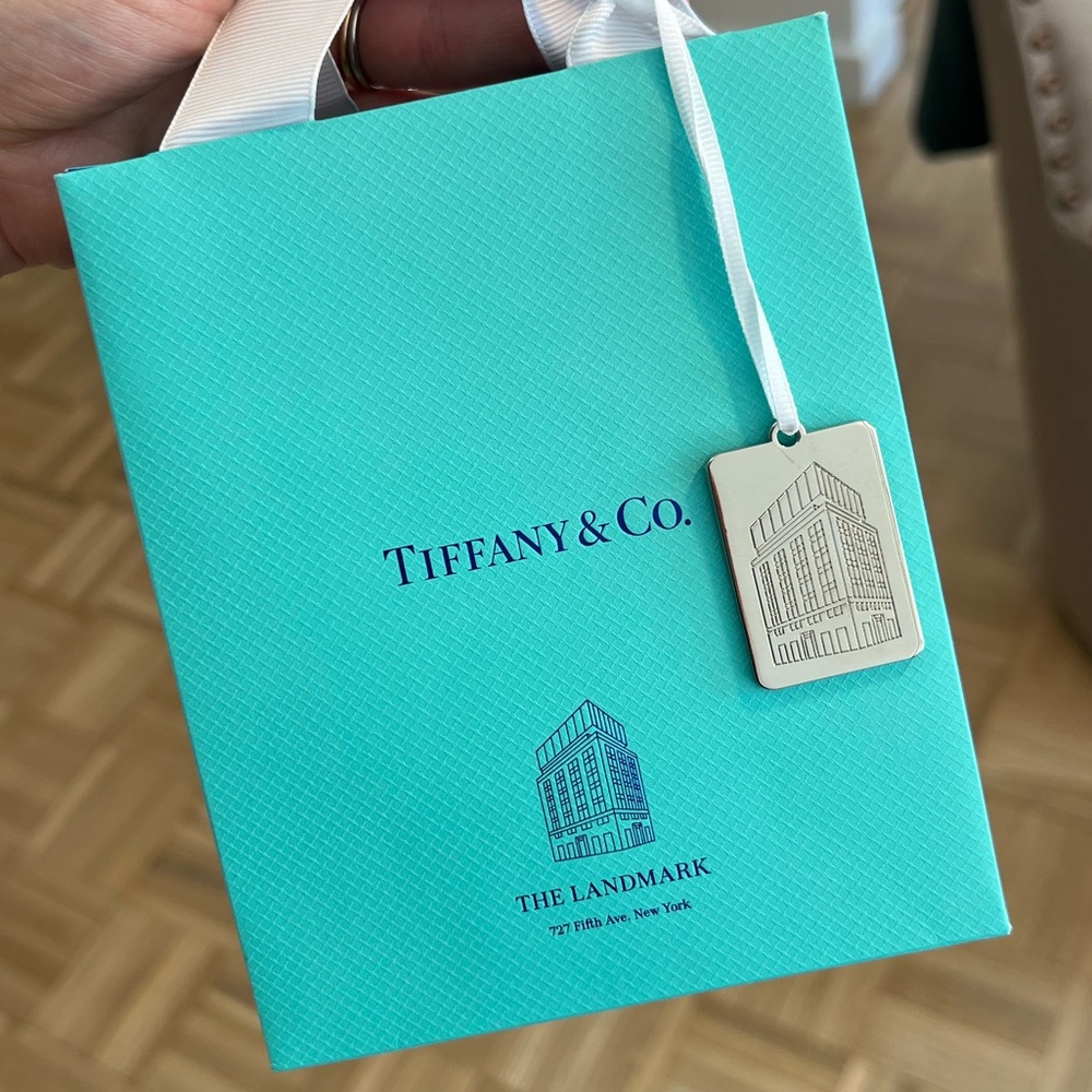 Tiffany Sterling Silver Charm from The Landmark, with box, ribbon, and bag